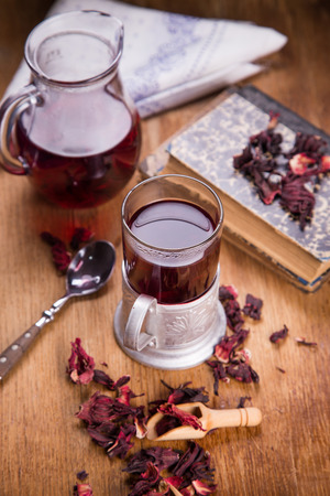 hot ruby tea from hibiscus in retro cup on wooden backgroundの写真素材