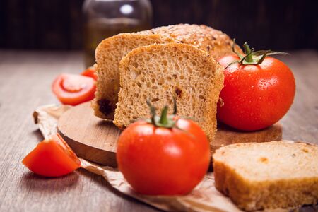 fresh tomato bread with sesame and fresh red tomatoesの写真素材