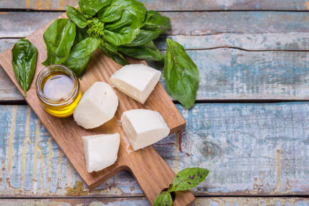 ingredients for caprese salad-fresh basil and mozzarellaの写真素材
