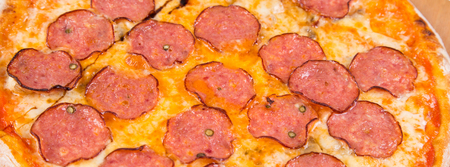 hot pizza with salami  isolated on white backgroundの写真素材