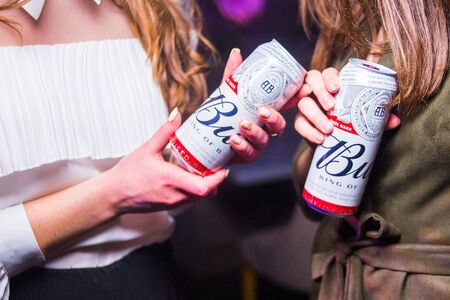 Kiev.Ukraine-17 March,2018: Product shot of Budweiser beer bottles in handsのeditorial素材