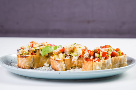 vegetable healthy bruschetta with cheese and basil,isolated on white