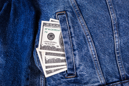 some banknotes of american dollars in jeans pocket-financional conceptの写真素材