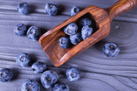 wooden support with fresh blueberry in studio-summer 2019の写真素材