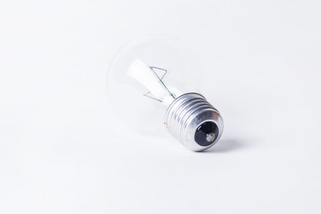Energy / Creative Thinking Concept. A perfect, clean light bulb switched on with filament glowing....
