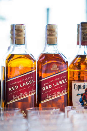 Kyiv,Ukraine - MAR 2020: Bottles of Johnnie Walker, the most widely distributed brand of blended Scotch whisky in the world with sales of over 130 million bottles a year.のeditorial素材