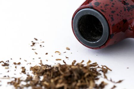 Fragment of red specks and tobacco pipe Withの写真素材