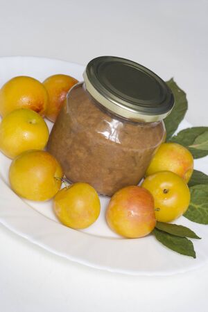 Incline photo of a pot of homemade prunes marmalade.の写真素材