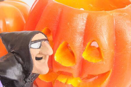 Funny witch and a couple of Halloween pumpkins.の写真素材