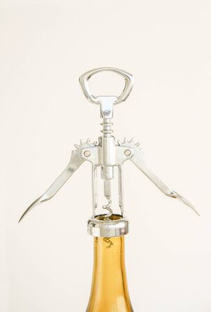 Hands down of the opener ready to open the bottle.の写真素材