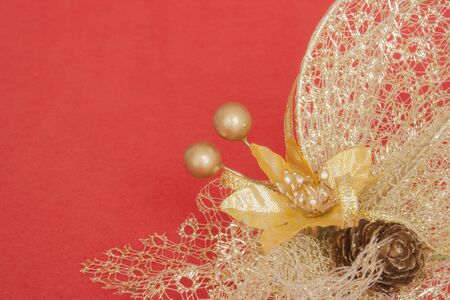 Small flower and cone with decorative ball in red background.の写真素材