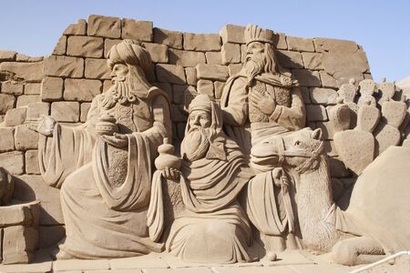 The three kings with presents in the birth of Jesus made with sand.の写真素材