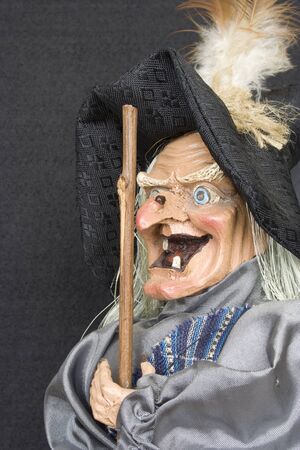 Close up of smiling witch  with black background.の写真素材