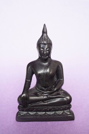 Buddha sitting down with a face full of serenity.の写真素材