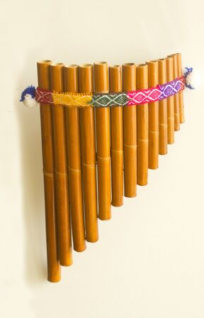 Peruvian decorated flute in a white background.の写真素材