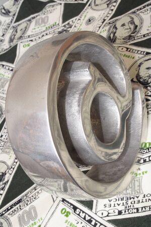 Symbol of Internet over notes of american dollarsの写真素材