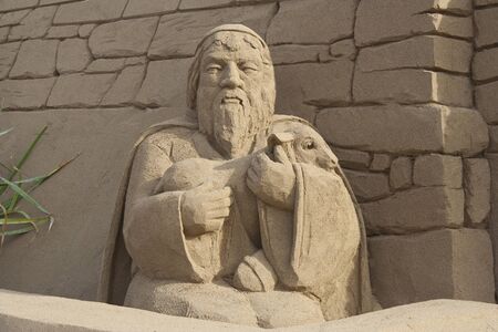 Sheppard carrying a lamb to the nativity cave.の写真素材
