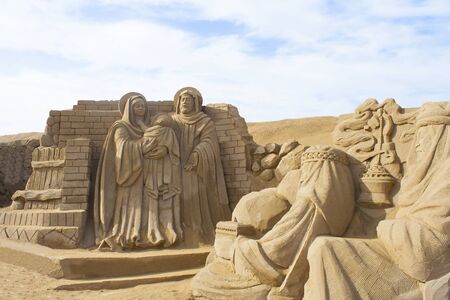 The three Kings offering their presents to baby Jesus.の写真素材
