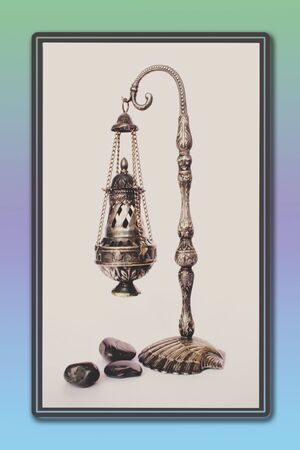 Nice brass incense burners and pebbles.の写真素材