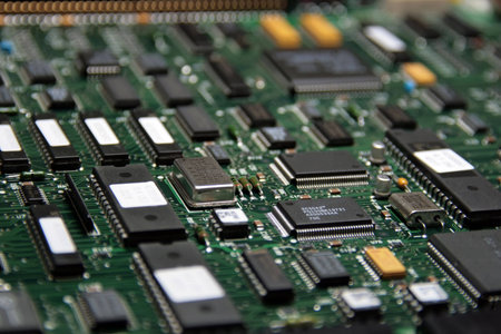 close-up photo of circuit board with semiconductor elements on itの写真素材
