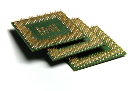 CPU in stack, close-up photo of computer hardware on white backgroundの写真素材