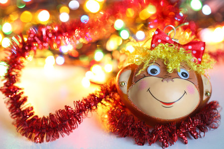 Smiling monkey christmas decoration. Pretty nice bokeh