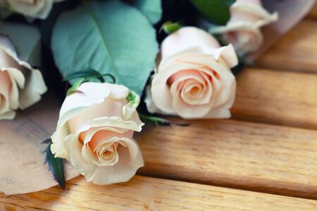 bouquet of Natural pastel roses. Wooden backgroundの写真素材