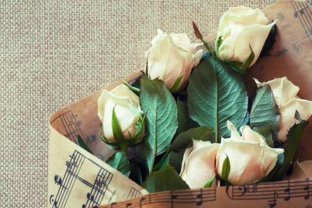 bouquet of Natural pastel roses. Textile backgroundの写真素材