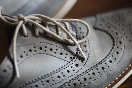 Grey oxford shoes. Close up. Selective focus with shallow DOF 