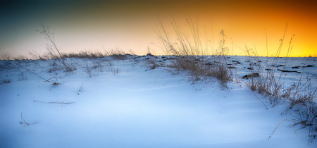 Beautiful winter landscape. Sunset over winter snow fieldsの写真素材