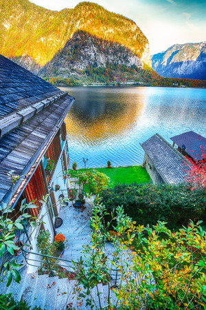 Wooden house on the coast of lake in Hallstatt village Austrian Alps. Location: resort village Hallstatt, Salzkammergut region, Austria, Alps. Europe.の写真素材