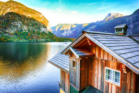 Wooden house on the coast of lake in Hallstatt village Austrian Alps. Location: resort village Hallstatt, Salzkammergut region, Austria, Alps. Europe.の写真素材