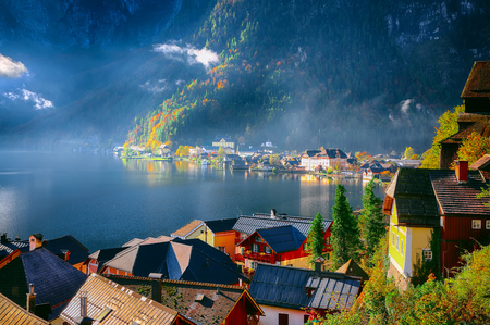 Views over roofs of the lake and Hallstatter and Hallstatt Lutheran Church. Location: resort village Hallstatt, Salzkammergut region, Austria, Alps. Europe.の写真素材
