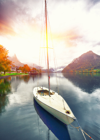 Yacht dock on the lake. Misty morning on the lake Grundlsee Location: resort Grundlsee, Liezen District of Styria, Austria, Alps. Europe.の写真素材
