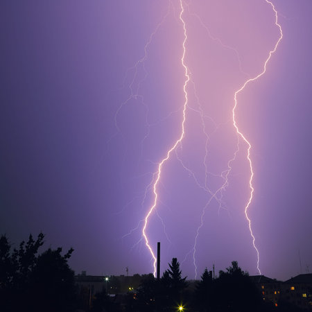 Lightning over the city. Powerfull flash at night