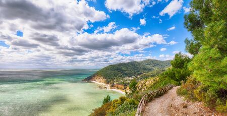 Picturesque islets Faraglioni di Puglia in summer Adriatic sea bay Baia Delle Zagare. Mattinata Faraglioni stacks and beach coast of Mergoli, Vieste Gargano, Apulia, Italy. Europeの写真素材