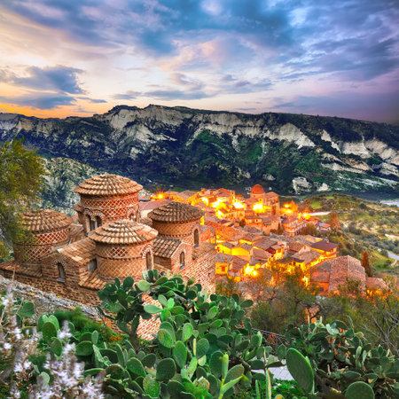 Sunset over old famous medieval village Stilo in Calabria. View on church and city. Southern Italy....