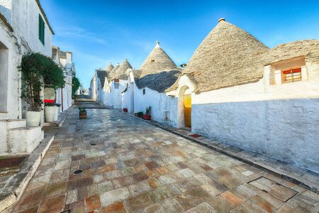 Trulli of Alberobello typical houses street view. Town of Alberobello, village with Trulli houses in Puglia Apulia region, Southern Italyの写真素材