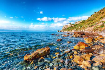 Dramatic spring sunset on the the cape Milazzo panorama of nature reserve Piscina di Venere.  Location: cape Milazzo,  Island Sicilia, Italy, Europe. Mediterranean and Tyrrhenian seaの写真素材