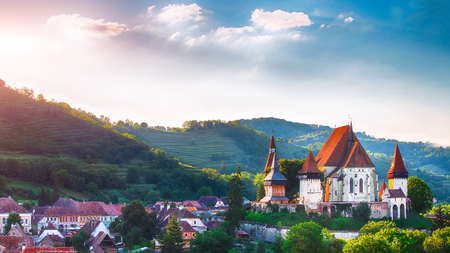 Beautiful medieval architecture of Biertan fortified Saxon church in Romania protected by Unesco World Heritage Site. Amazing sunset in Biertan.Transylvania, Sibiu, Biertan, Romania, Europe.のeditorial素材