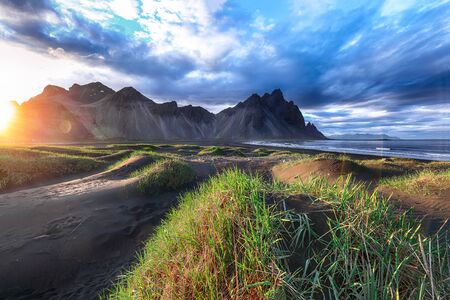 Fantastic sunny day  gorgeous black sand dunes on Stokksnes cape in Iceland. .の写真素材