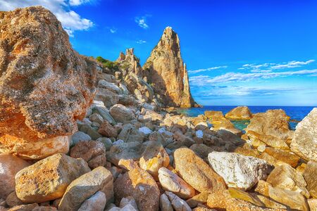 Spectacular view of Punta Pedra Longa and azure water in sea. Location: Baunei, Province of Nuoro, Sardinia, Italy, Europeの写真素材