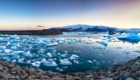 Beautifull landscape with floating icebergs in Jokulsarlon glacier lagoon at sunset. Location:...