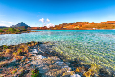 Geothermal landscape at Krafla Bjarnarflag Diatomite power station  and Hlidarfjall Mountain in the background . Location: Krafla Bjarnarflag Diatomite power station, Myvatn region, North part of Iceland, Europeの写真素材