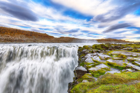 Dramatic sunset view  of the most powerful waterfall in Europe called Dettifoss. Location:...