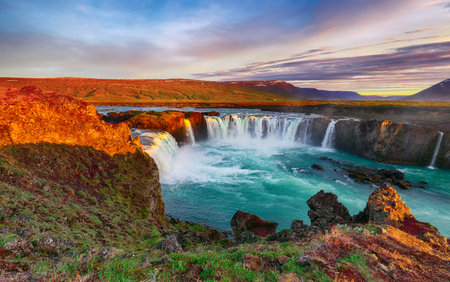 Fantastic sunrise scene of powerful Godafoss waterfall. Dramatic sky over Godafoss. Location: Bardardalur valley, Skjalfandafljot river, Iceland, Europeの写真素材