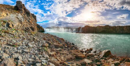 Fabulous scene of powerful Godafoss waterfall. Rocks at foreground. Location: Bardardalur valley, Skjalfandafljot river, Iceland, Europeの写真素材