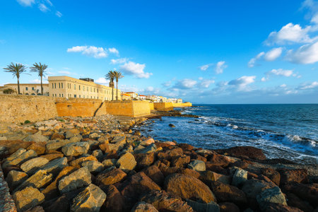 Gorgeous evening cityscape of historical part of Alghero town. Fantastic  Mediterranean seascape....