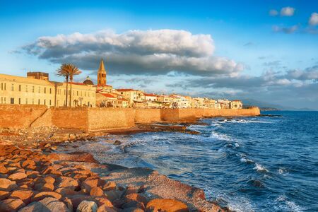 Gorgeous evening cityscape of historical part of Alghero town. Fantastic  Mediterranean seascape. Location:  Alghero, Province of Sassari, Italy, Europeの写真素材