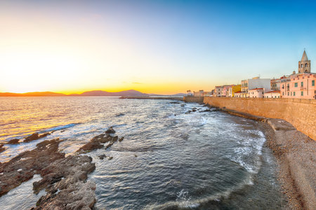 Gorgeous evening cityscape of historical part of Alghero town. Fantastic  Mediterranean seascape....